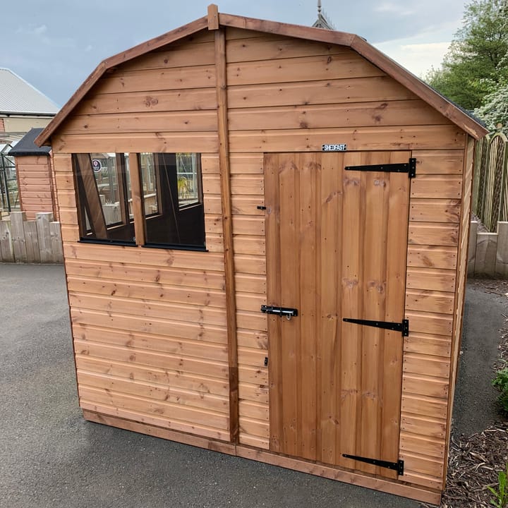 The Shedfast Dutch Barn shed is available in a range of sizes to suit all. 
Pictured here is the 8ft x 12ft model. The interchangeable windows and doors mean they can be positioned in any combination to suit your needs. The door is positioned in the gable end of this shed, but can easily be fitted on the side.

Black roofing felt is supplied as standard and the double pane windows are toughened safety glass with a pvc bottom cill.