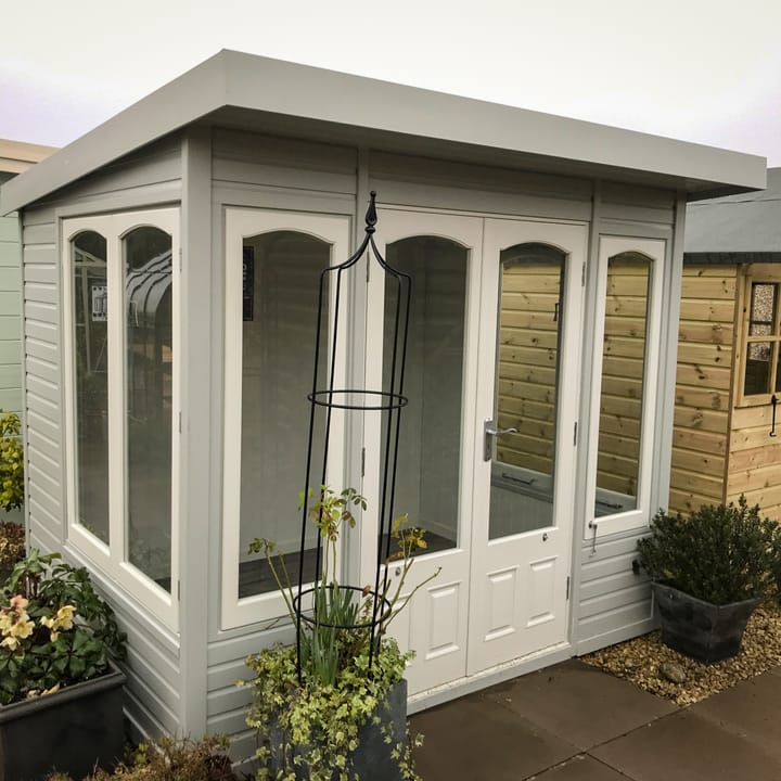 This 8ft x 6ft Malvern Stretton painted in Dove Grey colour option has a very contemporary feel about it. However, the arched windows and 'two-tone' painted finish, still maintain the 'cottage' elements.

Optional laminate flooring has also been added to this Stretton.