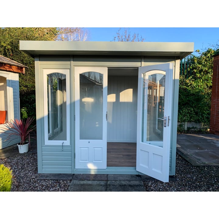 Optional 'Olive Grey' painted finish has been added to this 8ft x 6ft Malvern Stretton summerhouse. Also featured in this photo is the optional laminate floor upgrade, painted mdf lining and insulation and chrome upgrade.