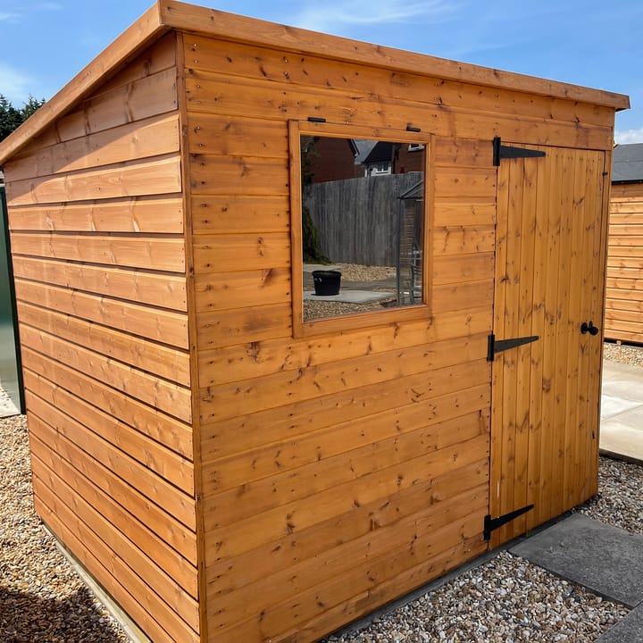 8ft x 6ft Bewdley Pent in Redwood on display at our Angmering branch. The door has been positioned on the front to the right of the window. Note the opening window, a standard feature on all Bewdley sheds.
