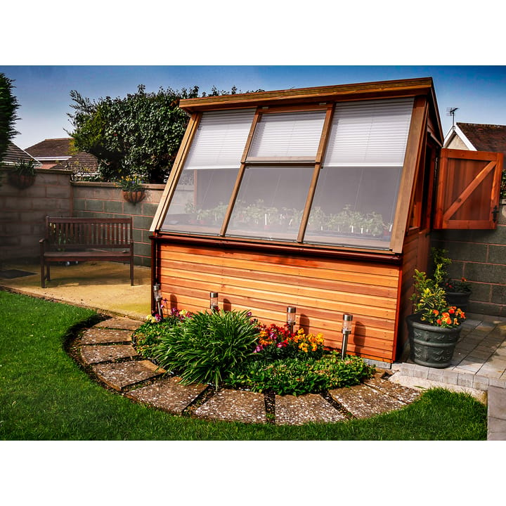 This stunning 8ft x 6ft Malvern Potting Shed is constructed in premium grade Western Red Cedar. The door has been positioned in the right-hand end with the optional stable door upgrade included.

The Solar is great for starting little seedlings and planting cuttings, the angled slope of the glazing allows direct sunlight onto the plants.

This customer has installed their own internal blinds to help regulate the temperature!