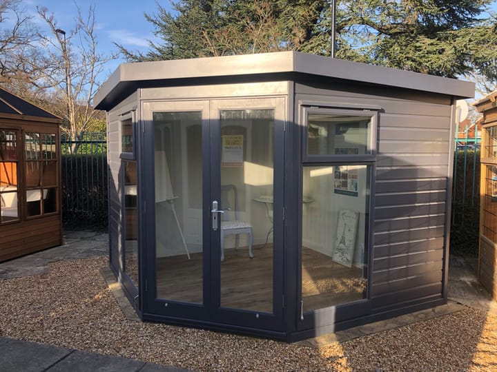 At 9ft x 9ft - this Studio Corner Pent painted in optional 'Graphite Grey' colour finish looks stunning! Optional painted mdf lining and insulation and a laminate floor have also been added.