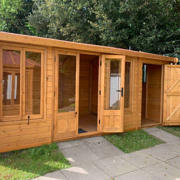 12ft x 6ft Astwood with square topped windows and 4ft shed extension. Unpainted Redwood. 