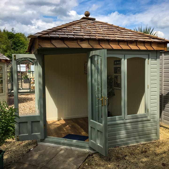 This 8ft x 8ft Malvern Clifton is painted in Malvern Green colour. The corner overhang above the double door provides a nice feature to the Clifton range. Optional laminate floor has also been added.