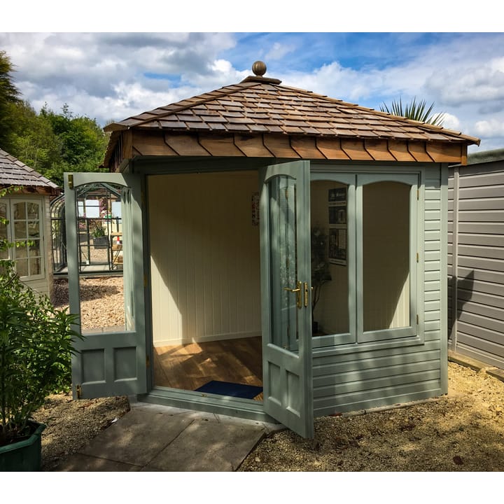 This 8ft x 8ft Malvern Clifton is painted in Malvern Green colour. The corner overhang above the double door provides a nice feature to the Clifton range. Optional laminate floor has also been added.