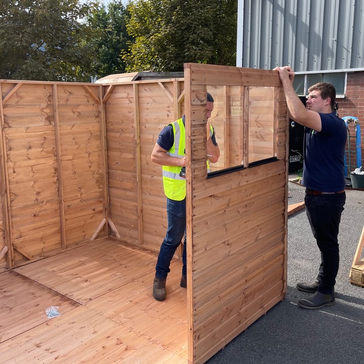 Assembling our Shedfast Dutch barn sheds is a two person job. Assembly of the side sections is made easier by one person holding the 2 panels together, while another person screws the panels together from the inside.