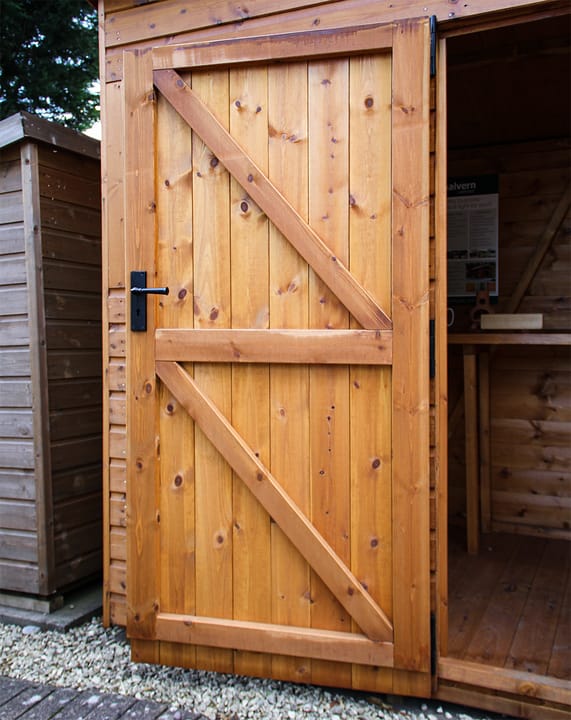 This picture illustrates the strength of a Malvern Heavy Duty shed door. Fully framed, ledged and braced, this door will not go out of square! It has a built-in 3 lever mortice lock for security.
For additional security measures, you can choose to add the optional 'Security Pack' upgrade.

*Please note - the door width on a 4ft wide Apex shed is 0.66m, for all other width's it is 0.89m.