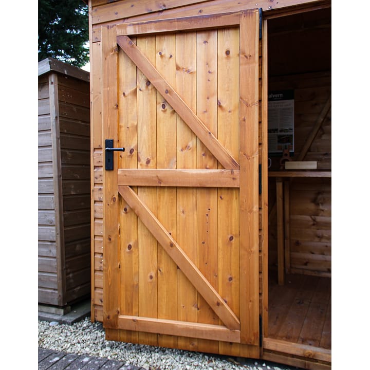 This picture illustrates the strength of a Malvern Heavy Duty shed door. Fully framed, ledged and braced, this door will not go out of square! It has a built-in 3 lever mortice lock for security.
For additional security measures, you can choose to add the optional 'Security Pack' upgrade.

*Please note - the door width on a 4ft wide Apex shed is 0.66m, for all other width's it is 0.89m.