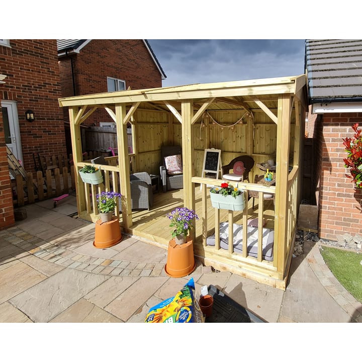 This 12ft x 8ft Hanbury Apex, provides a nice outdoor open shelter. Optional half boarded panels have been added to the sides and back of the building, as well as the optional pressure treated slatted roof and timber floor.