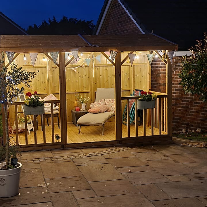 With a little lighting and decoration, the Hanbury Apex is the ideal summerhouse to entertain guests on warm summer evenings.