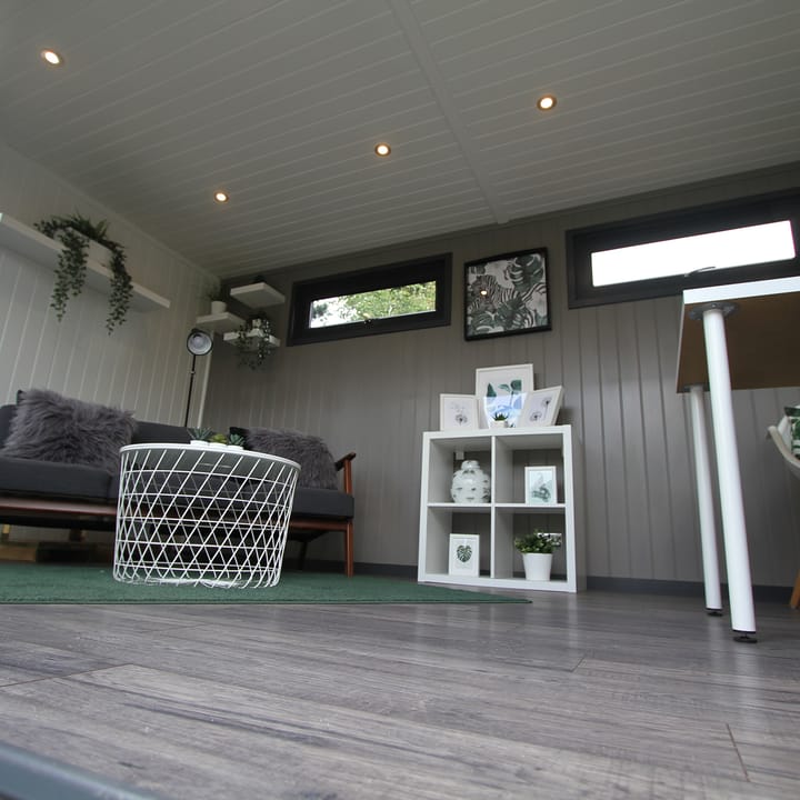 This interior view of a Hanley Plus flat garden room, illustrates how the styling and colour scheme can be used to great effect. The mdf lining on the back wall has been painted in a shade of grey and creates a focal point of this building.