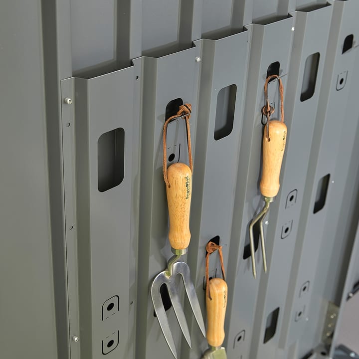 An integrated door panel organisation system provides a unique and space saving way, to store your many garden tools. Ideal for hand trowels and forks.