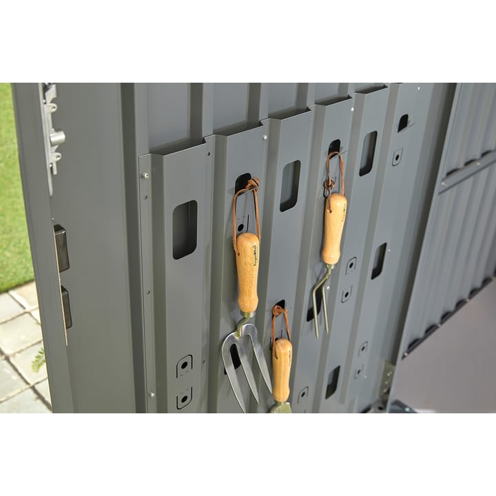An integrated door panel organisation system provides a unique and space saving way, to store your many garden tools. Ideal for hand trowels and forks.