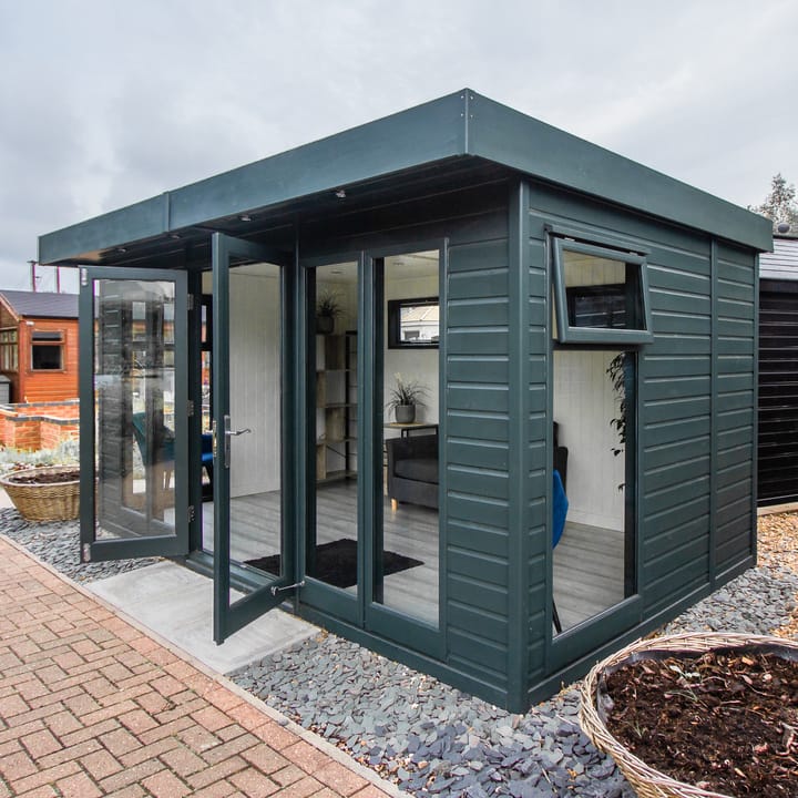 14ft x 8ft Malvern Studio Flat in optional Green Black painted finish. Optional laminate flooring and Painted mdf lining and insulation have also been selected.