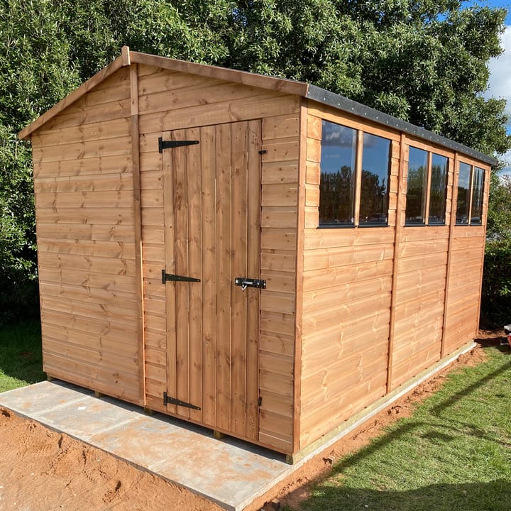 The Shedfast Apex shed is available in a range of sizes to suit all. 
Pictured here is the 8ft x 12ft model. The interchangeable windows and doors mean they can be positioned in any combination to suit your needs. The door is positioned in the gable end of this shed, but can easily be fitted to the side.

Black roofing felt is supplied as standard and the double pane windows are toughened safety glass with a pvc bottom cill.