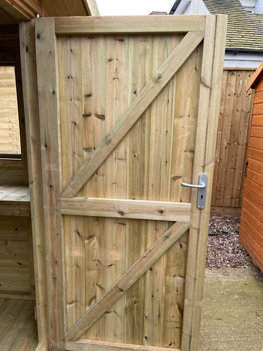 This picture illustrates the strength of a Malvern Heavy Duty shed door. Fully framed, ledged and braced, this door will not go out of square! It has a built-in 3 lever mortice lock for security.
For additional security measures, you can choose to add the optional 'Security Pack' upgrade.

*Please note - the door width on a 4ft wide Apex shed is 0.66m, for all other width's it is 0.89m.