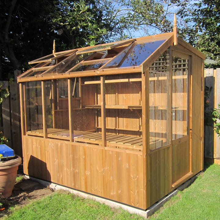This 6ft x 8ft Swallow Jay greenhouse has the optional unpainted Thermowood finish. greenhouse.