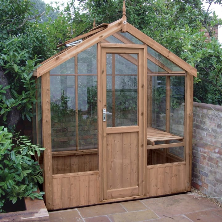This 6ft x 4ft Kingfisher greenhouse is manufactured from Thermowood. Staging to one side and automatic roof vents are a standard feature.
