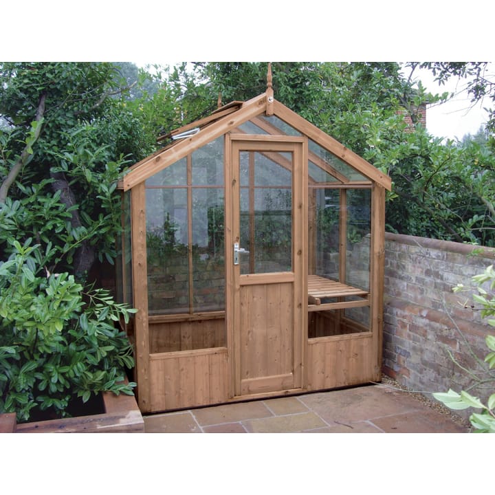 This 6ft x 4ft Kingfisher greenhouse is manufactured from Thermowood. Staging to one side and automatic roof vents are a standard feature.