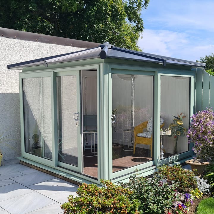 This Nordic Madison Corner Hipped is the 2.7m x 2.7m model in optional Chartwell Green finish. Other optional upgrades for this building as shown are the tile effect roof and vinyl flooring.