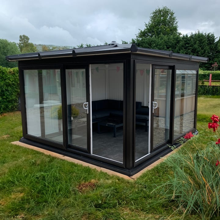 Nordic Madison Corner Hipped 3.3m x 3.3m Ultimate Package in Black. 

The ultimate package includes a tile effect roof, vinyl flooring and a concrete base installed by a dedicated team of experts.