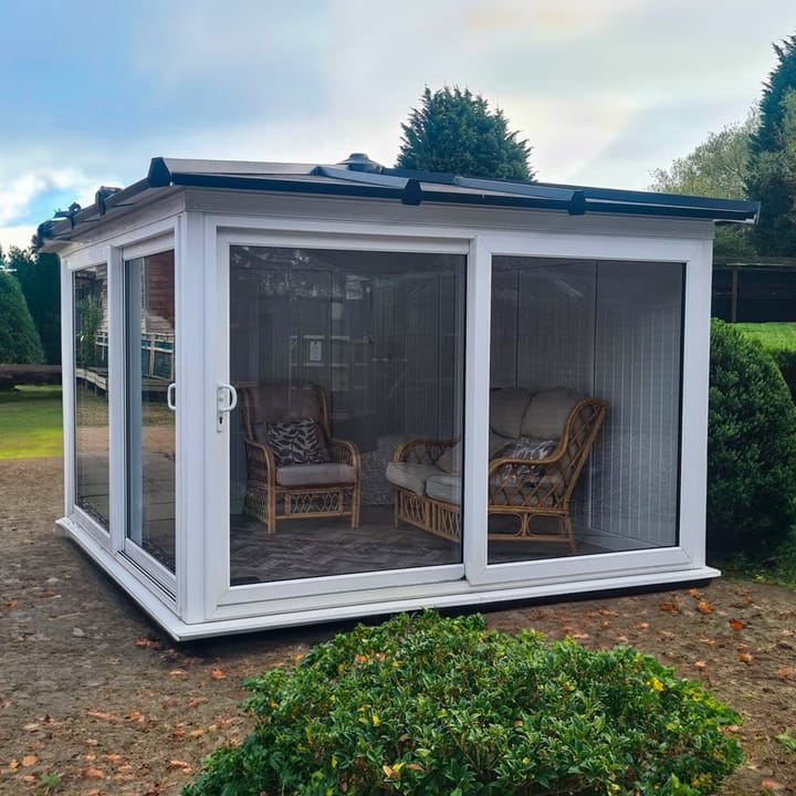 This Nordic Madison Corner Hipped is the 3.3m x 3.3m model in optional White finish. Other optional upgrades for this building as shown are the tile effect roof and vinyl flooring.