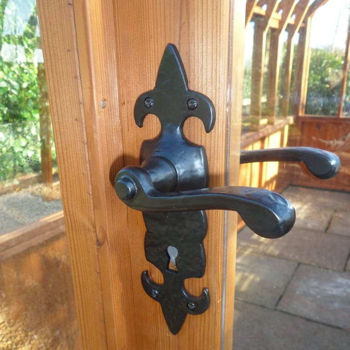 You can choose to upgrade the door handle on your greenhouse, to an ornate style door handle.