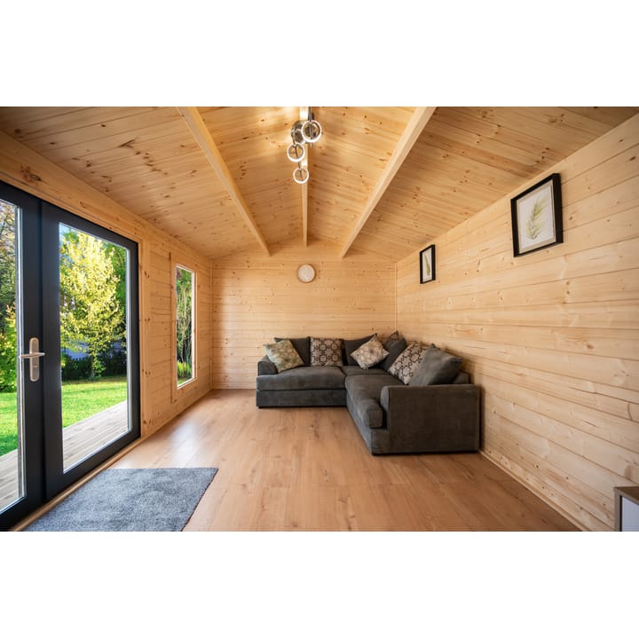 This interior photo of a 5m x 3m Pavilion gives a good idea of what you can expect from the interior of a log cabin. There's a warm and airy feeling to this cabin and the laminate flooring gives a nice light contrast to the natural timber finish. 