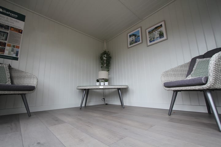 You can choose to line your Studio Corner Pent garden room with either tongue and groove pine boards, or as pictured here painted mdf lining. Both lining options include ufoil thermal insulation, for all year-round warmth. The optional laminate floor adds a nice finishing touch this garden room.