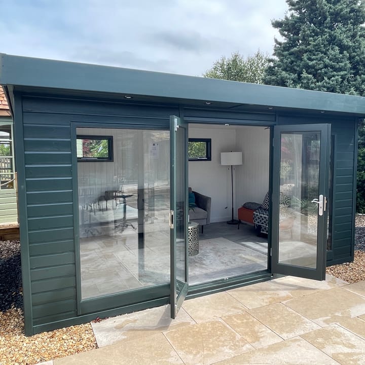 This Studio Flat measures 14ft wide x 10ft deep. Optional Green Black painted finish, painted mdf lining and insulation and laminate flooring are also on display.

*Note - this Studio Flat has the wider 41in windows to the front of the building, either side of the double doors.