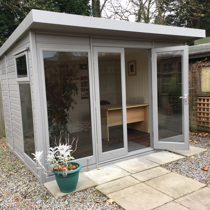 10ft x 8ft Studio Pent in Urban Grey optional painted finish. Other optional upgrades added to this building include; tinted glass windows, painted mdf lining and insulation and a deluxe laminate floor.