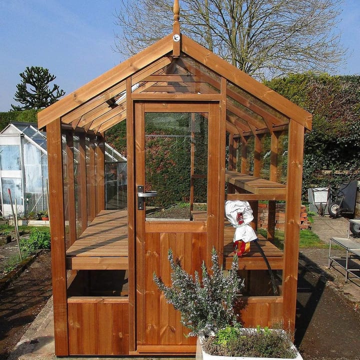 The popular 5ft8 wide Robin, from Swallow, is the ideal wooden greenhouse for the smaller garden. Shown here as an 8 ft long model, in plain finished ThermoWood®