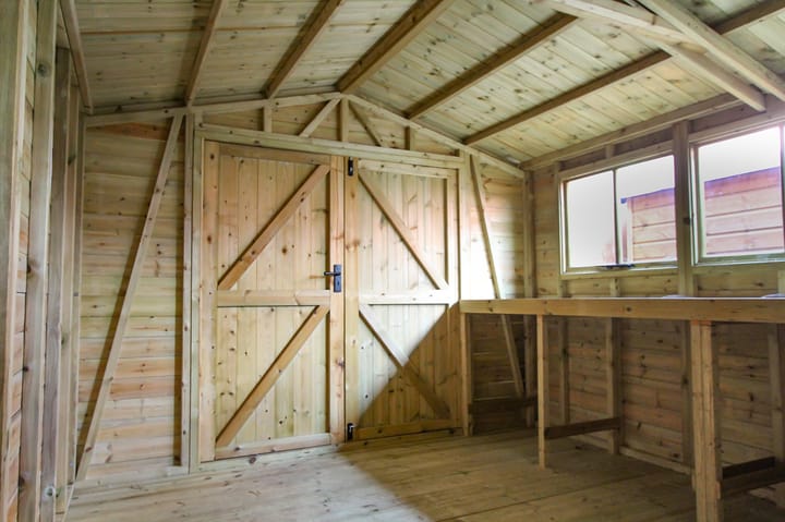 This interior view of a Malvern Heavy Duty Apex illustrates the diagonal bracing in the gable end section and side panel - Without these the front of the building would go out of square and the doors wouldn't open properly. A simple precaution you would think but one which isn't featured on many competitors' buildings. A staple feature of all Heavy Duty sheds.

Also seen here is the internal view of the ledged and braced doors; this means that the doors are cross braced so they won't move out of square and that the edges are all reinforced.