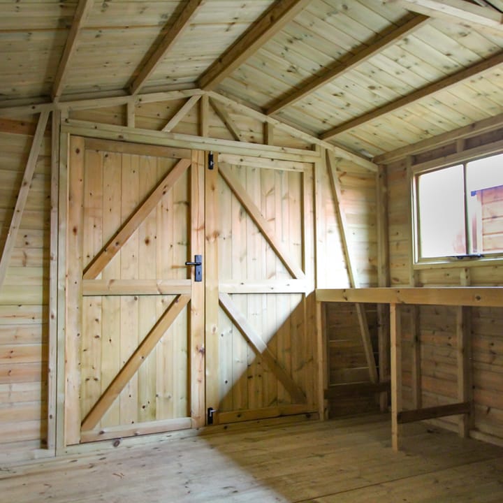 This interior view of a Malvern Heavy Duty Apex illustrates the diagonal bracing in the gable end section and side panel - Without these the front of the building would go out of square and the doors wouldn't open properly. A simple precaution you would think but one which isn't featured on many competitors' buildings. A staple feature of all Heavy Duty sheds.

Also seen here is the internal view of the ledged and braced doors; this means that the doors are cross braced so they won't move out of square and that the edges are all reinforced.
