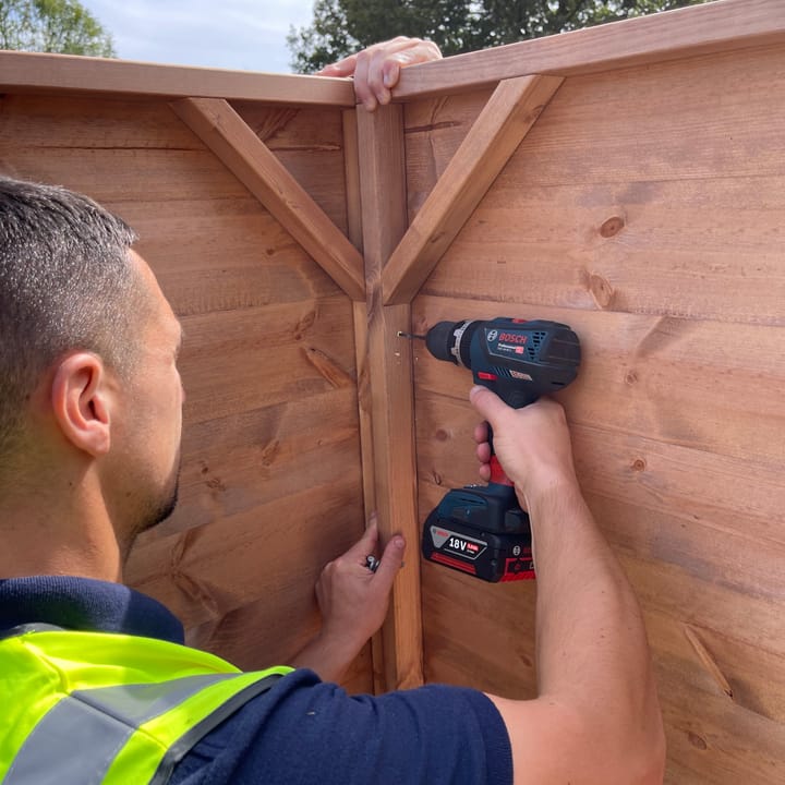 Assembling our Shedfast apex sheds is a two person job. Assembly of the side sections is made easier by one person holding the 2 panels together, while another person screws the panels together from the inside.