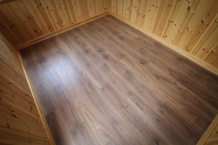 All Malvern Studio and Arley buildings include a solid timber floor as standard. For the complete finish and to complement the lining options available, you can choose to add deluxe laminate floor to your garden room in a choice of 10 styles. Pictured here is Renaissance Oak laminate flooring.