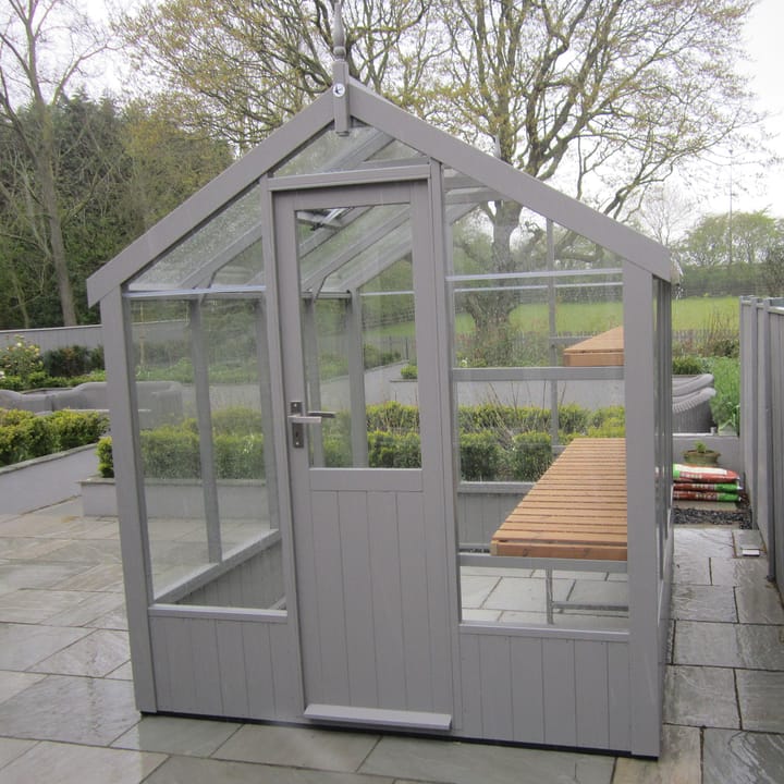 This 6ft x 8ft Swallow Kingfisher greenhouse has the optional 'Moles Breath' painted finish. Optional high level shelving has been added to this greenhouse.